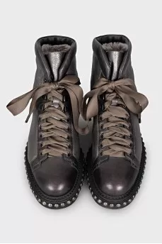 Leather boots with studs on the soles