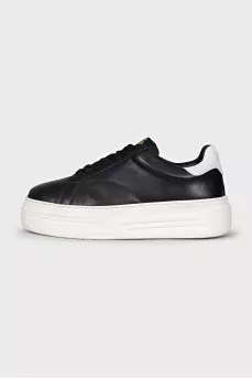 Black leather sneakers with white soles
