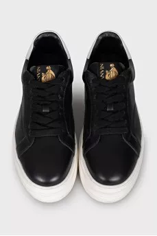 Black leather sneakers with white soles