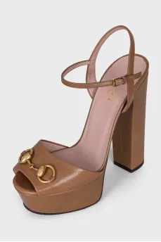 Brown sandals with gold decor