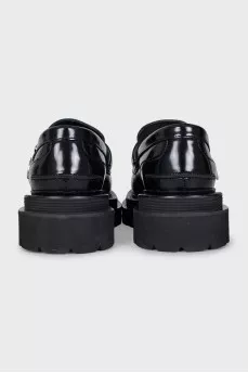 Black leather loafers with tag