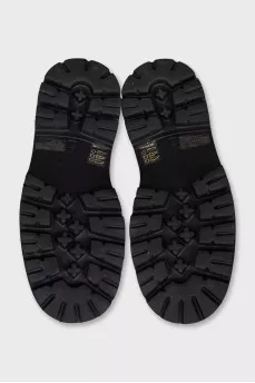 Black leather loafers with tag