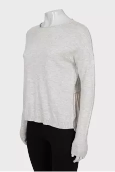Jumper decorated with pleats
