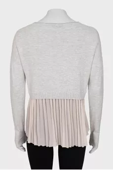 Jumper decorated with pleats