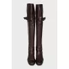 Brown leather over-the-knee boots with buckle