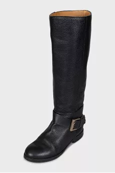 Black boots with a gold buckle