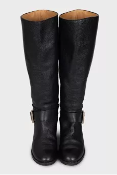 Black boots with a gold buckle