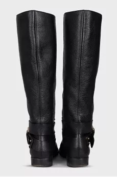 Black boots with a gold buckle
