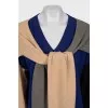 The dress is decorated with ties with a tag