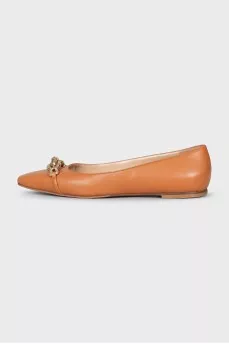 Brown ballet flats with a curved toe