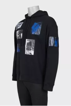 Men's hoodie decorated with patches