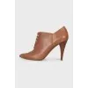 Leather ankle boots with a front zip