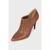 Leather ankle boots with a front zip