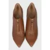 Leather ankle boots with a front zip