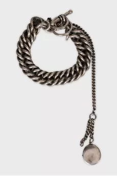 Silver bracelet with a medallion