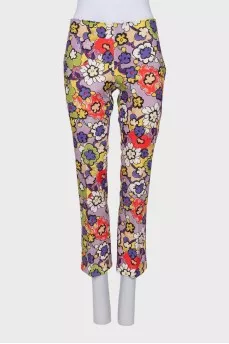 A suit with a bright print decorated with sequins