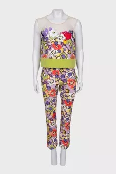 A suit with a bright print decorated with sequins