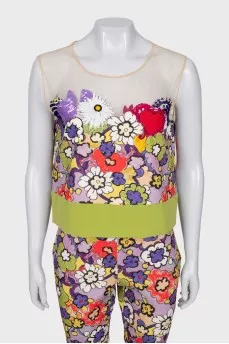 A suit with a bright print decorated with sequins