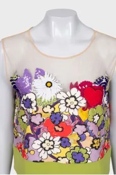 A suit with a bright print decorated with sequins