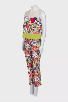 A suit with a bright print decorated with sequins