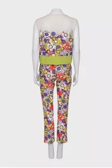 A suit with a bright print decorated with sequins