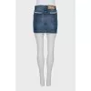 Denim skirt decorated with lace