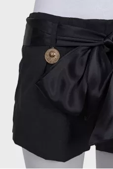 Short shorts with a silk belt