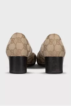 Textile shoes with a signature monogram