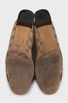Textile shoes with a signature monogram