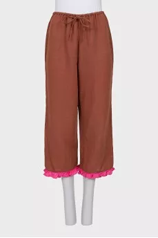 A ruffled cropped pants and top suit