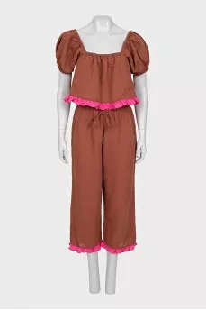 A ruffled cropped pants and top suit