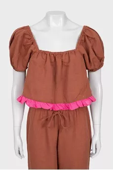 A ruffled cropped pants and top suit