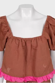 A ruffled cropped pants and top suit