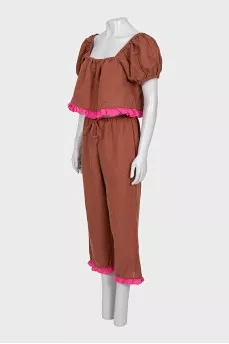 A ruffled cropped pants and top suit