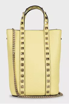 Yellow leather bag with studs