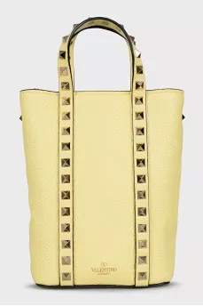 Yellow leather bag with studs