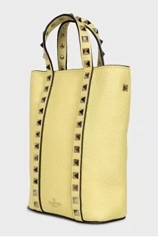 Yellow leather bag with studs