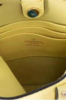 Yellow leather bag with studs