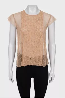 Sheer top decorated with frills
