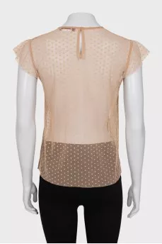 Sheer top decorated with frills