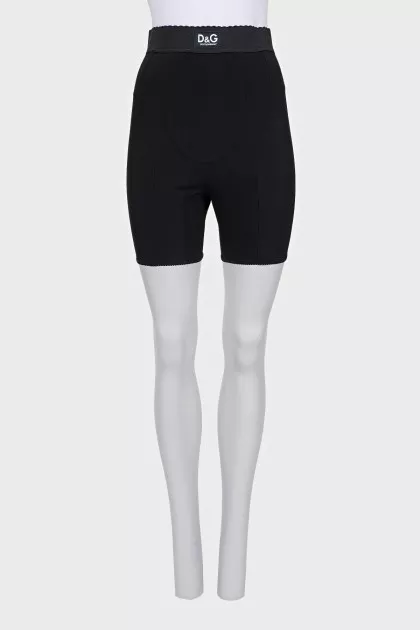 Black shorts with raised seams and tag