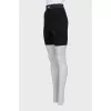 Black shorts with raised seams and tag