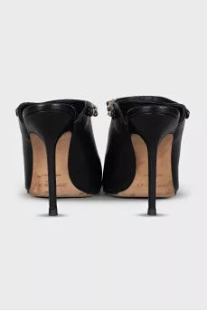 Black leather mules with gold trim