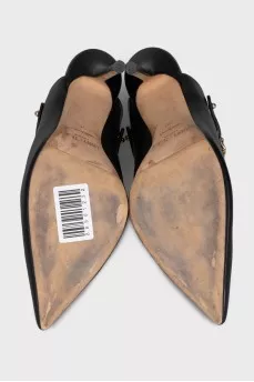 Black leather mules with gold trim