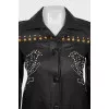 Leather jacket decorated with rivets and crystals