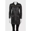 Leather jacket decorated with rivets and crystals