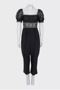 Jumpsuit with openwork sleeves decorated with crystals