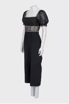 Jumpsuit with openwork sleeves decorated with crystals