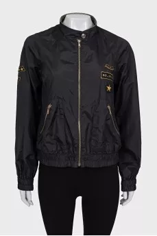 Jacket with a zipper and a patch