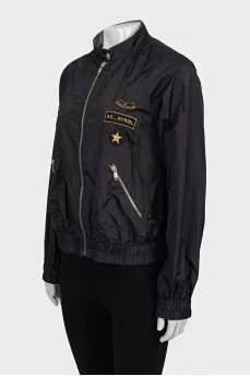 Jacket with a zipper and a patch